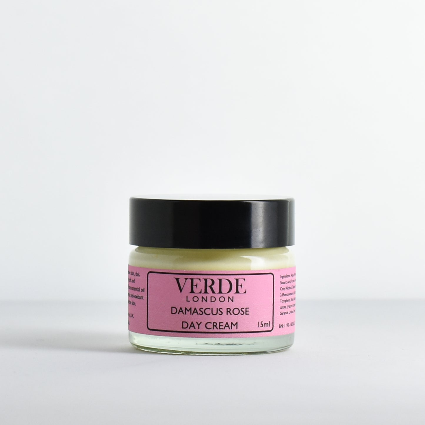 Glass jar of Damascus Rose Day Cream by Verde London with a pink label on a white background