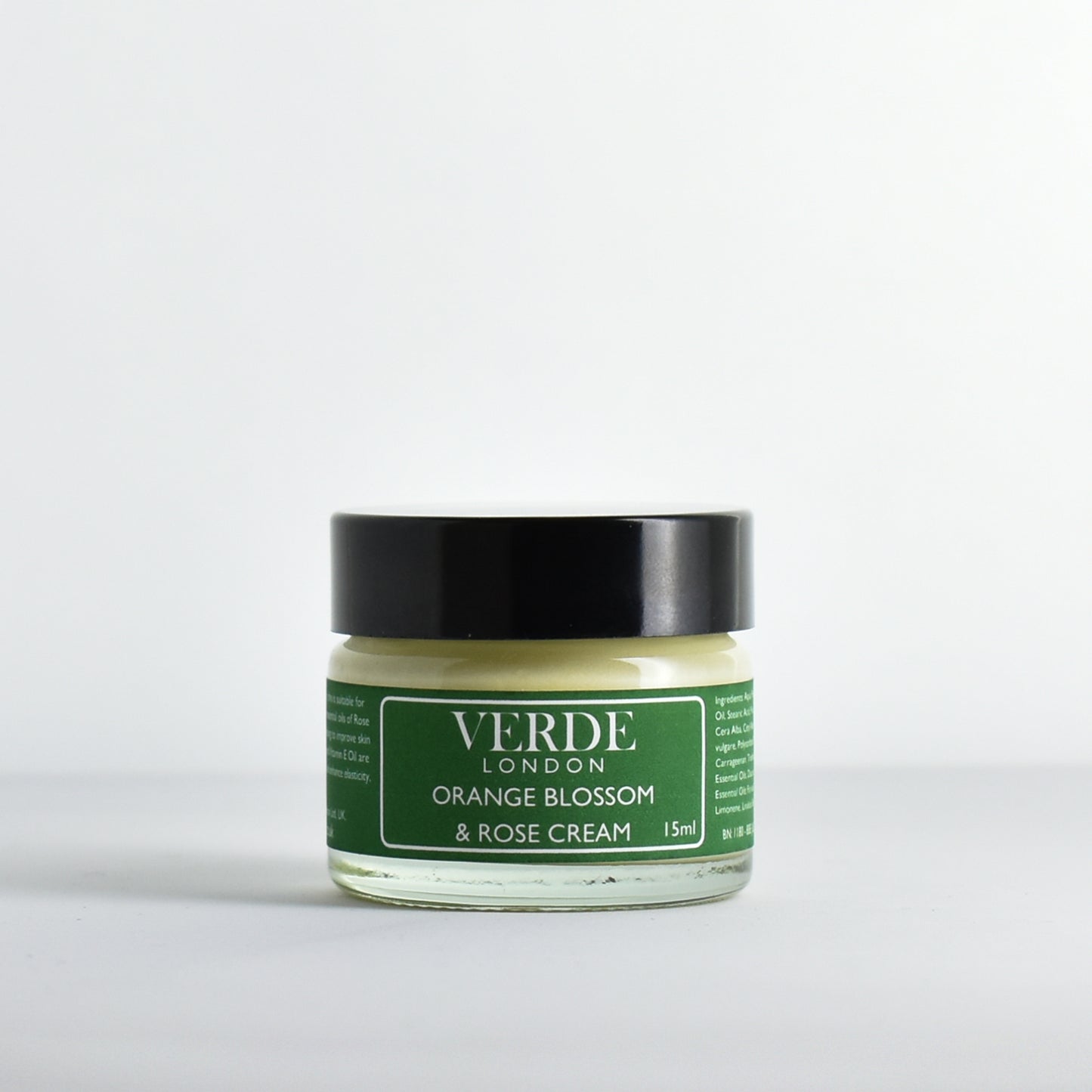 Glass jar of Orange Blossom and Rose cream with a green label by the brand Verde London on a white background
