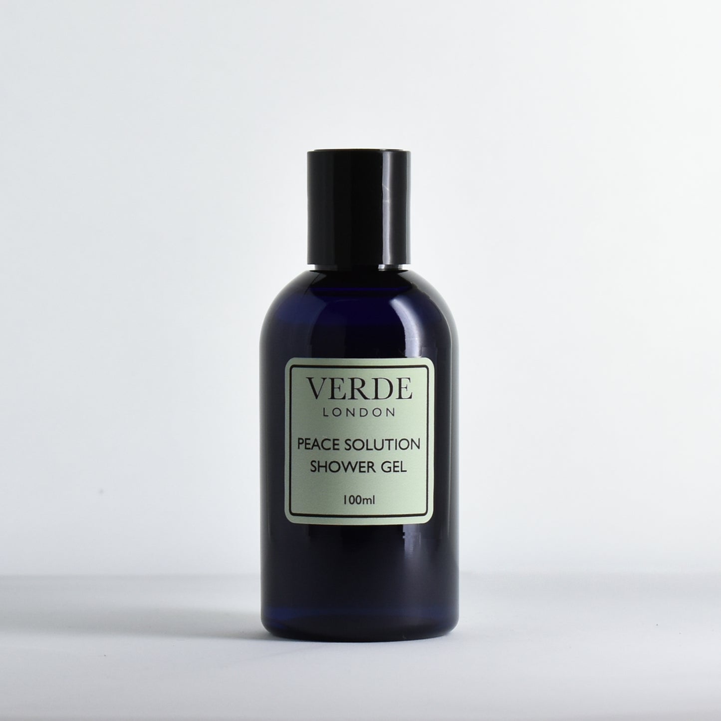 Blue bottle of Verde London Peace Solution Shower Gel on a white background