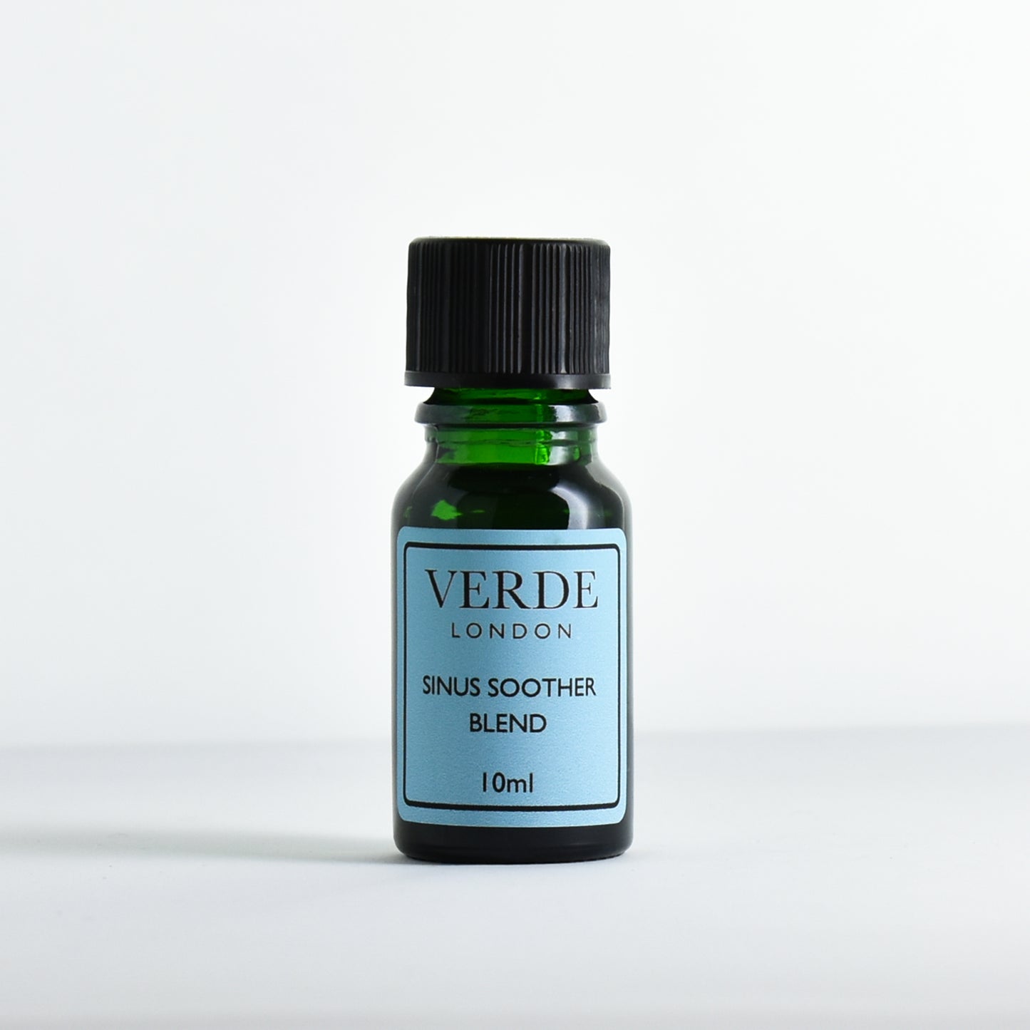Green glass dropper bottle labeled 'Verde London Sinus Soother Blend' on a white background