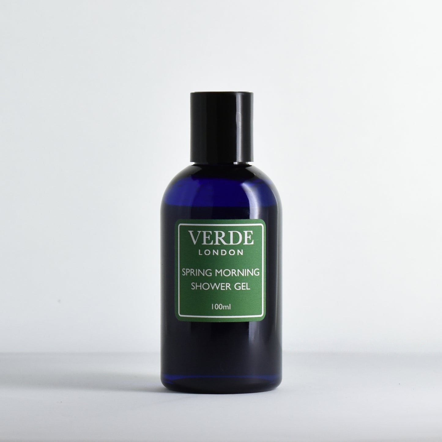 Blue bottle of Verde London Spring Morning shower gel with a green label on a white background