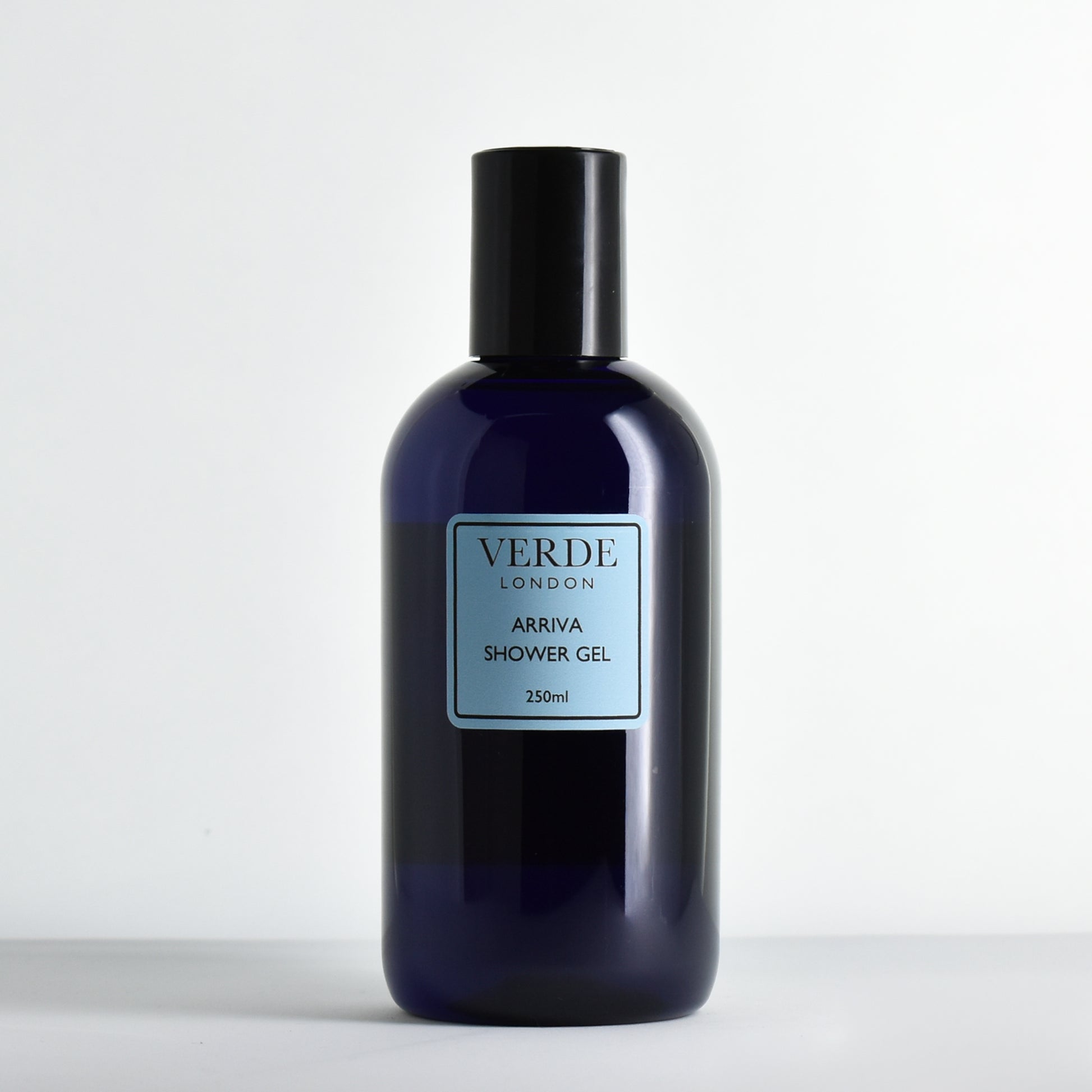 Blue bottle of Verdé London Arriva shower gel with a blue label on a white background