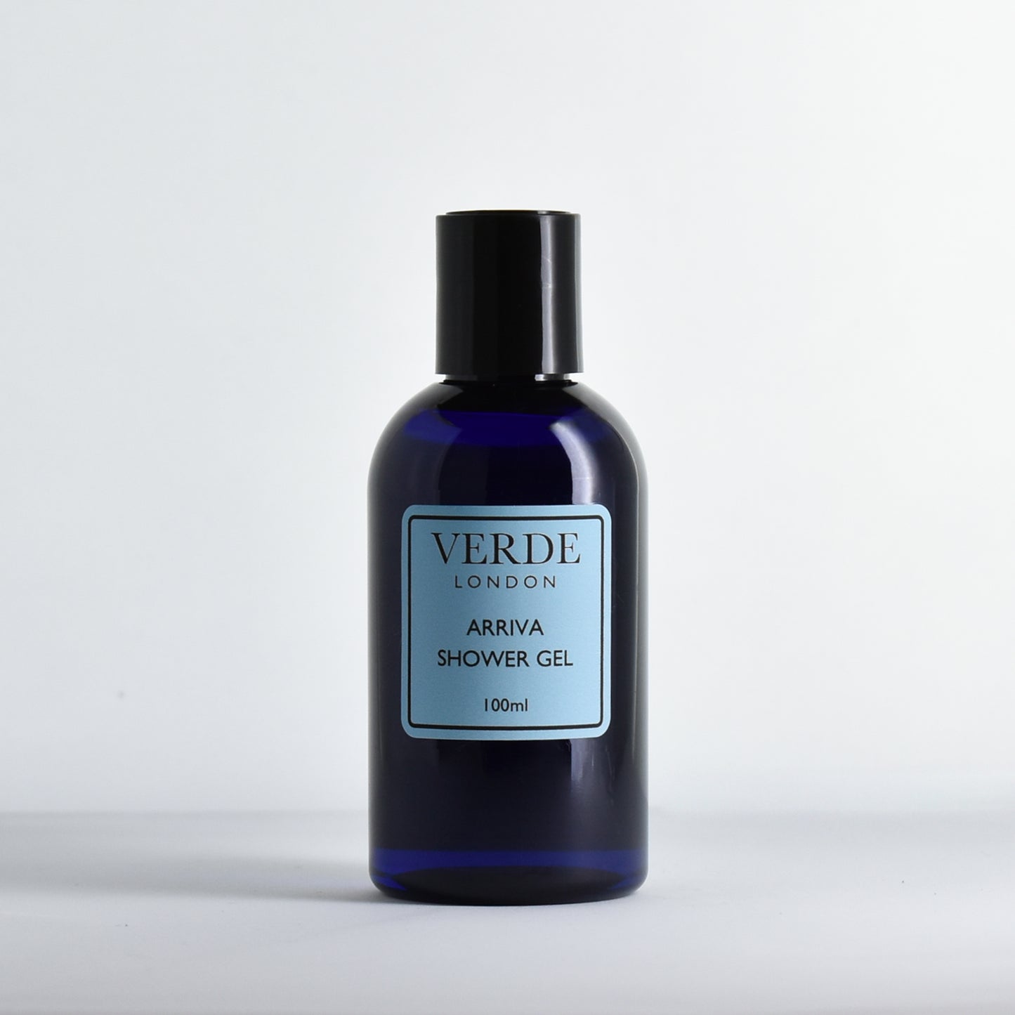 Blue bottle of Verdé London Arriva shower gel with a blue label on a white background