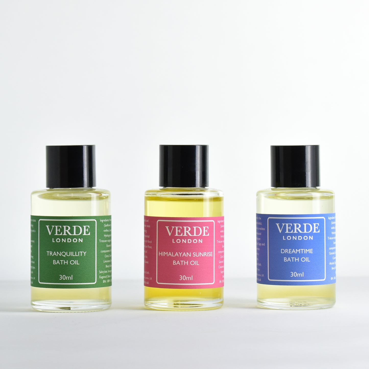 Three bottles of mini Verde London bath oils including Dreamtime, Tranquillity and Himalayan Sunrise on a white background