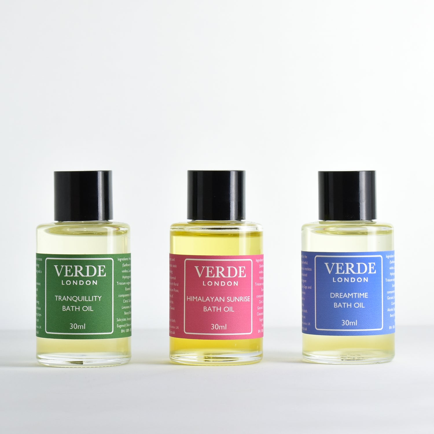 Three bottles of mini Verde London bath oils including Dreamtime, Tranquillity and Himalayan Sunrise on a white background