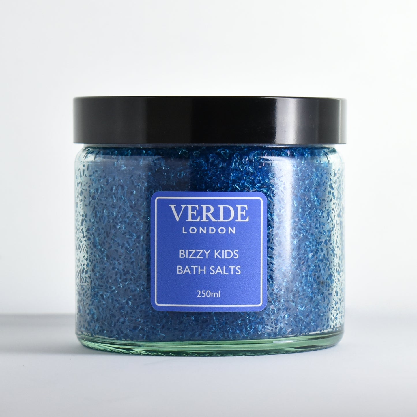Glass jar blue of 'Bizzy Kids Bath Salts' by Verde London on a white background