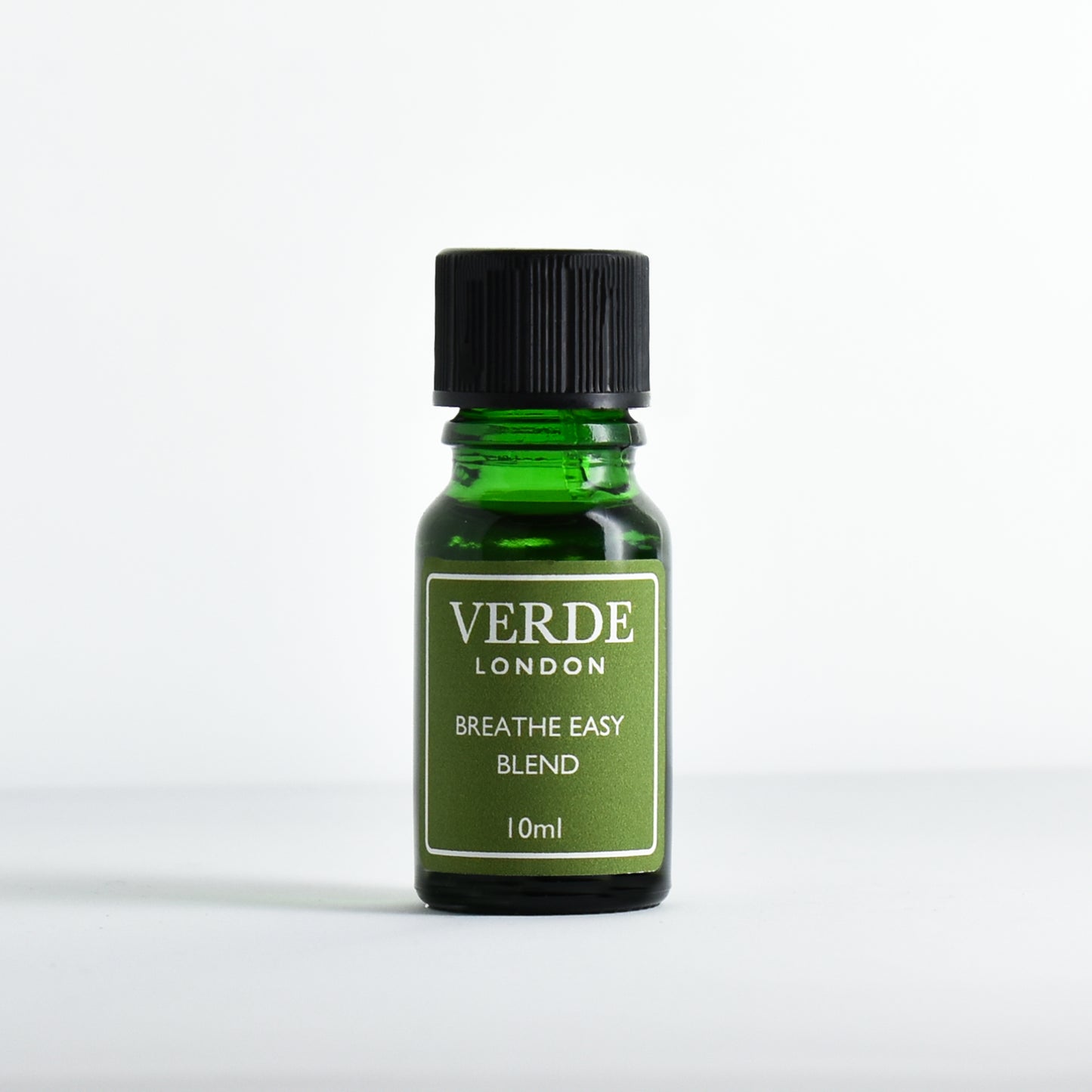 Green glass dropper bottle labeled 'Verde London Breathe Easy Blend' on a white background