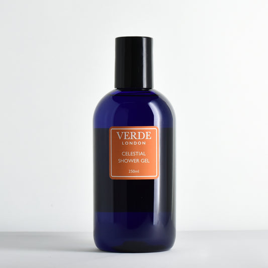 Blue bottle of Verde London Celestial Shower Gel with an orange label on a white background