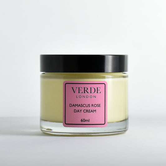 Glass jar of Damascus Rose Day Cream by Verde London with a pink label on a white background