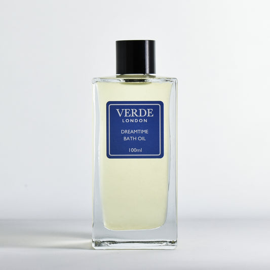 Bottle of Dreamtime Bath oil by Verde London with a dark blue label in a rectangular glass bottle on a white background
