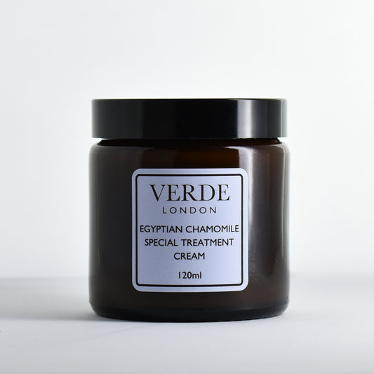 Amber glass jar of Verde London Egyptian Chamomile Special Treatment Cream with a pale blue label on a white background
