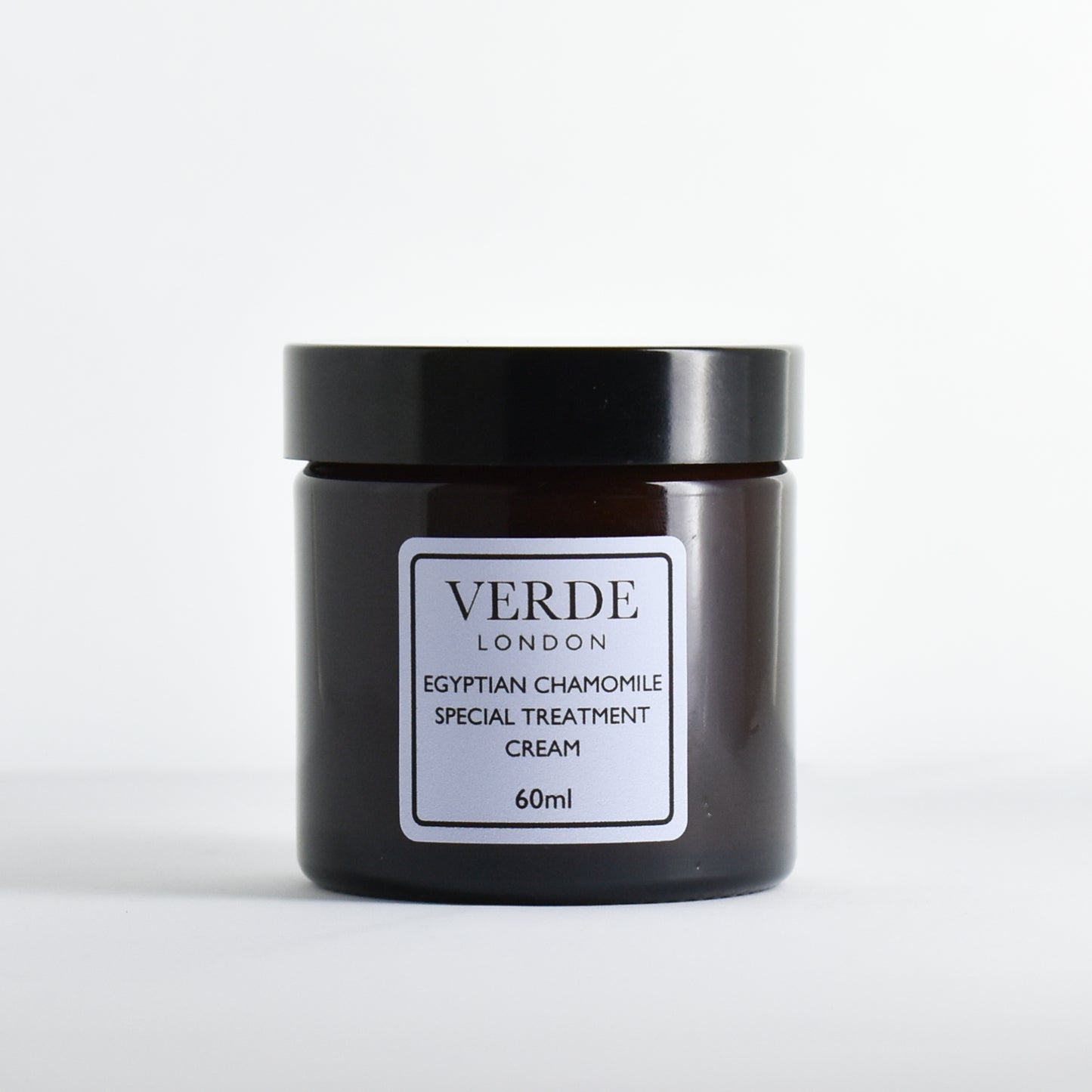 Amber glass jar of Verde London Egyptian Chamomile Special Treatment Cream with a pale blue label on a white background