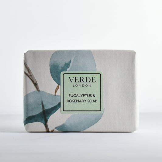 Bar of Eucalyptus & Rosemary soap wrapped in colourful paper with a pale green 'Verde London' label on a white background