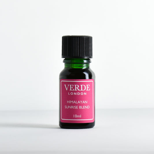 Green glass dropper bottle with pink label containing 'Himalayan Sunrise Blend' by Verde London on a white background.