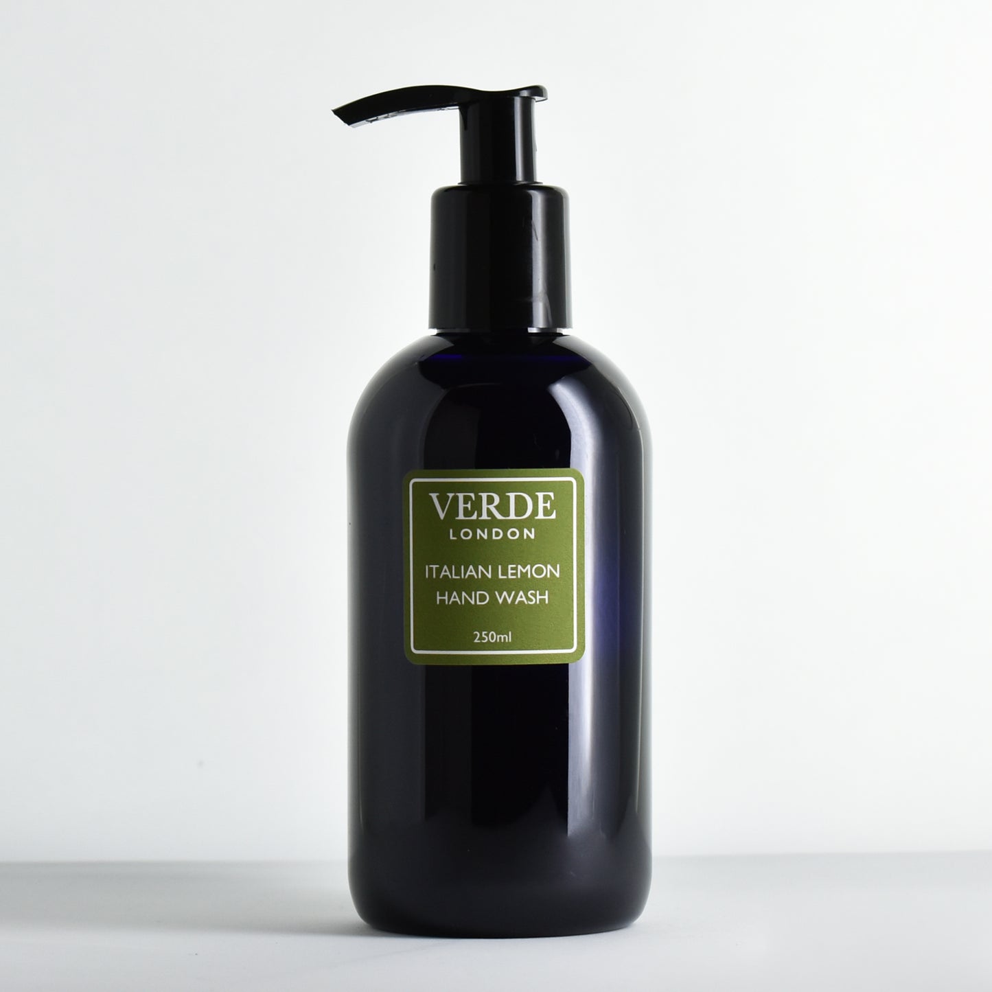 Dark bottle of Verde London Italian Lemon Hand Wash with a green label on a white background