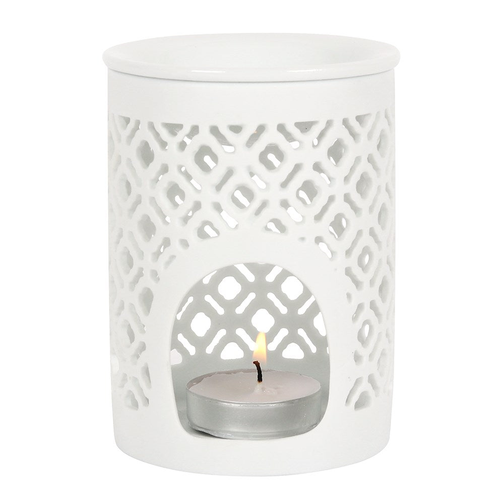 White ceramic oil burner with a lattice cut out design, featuring a bowl on top and a space to add a tea light candle.