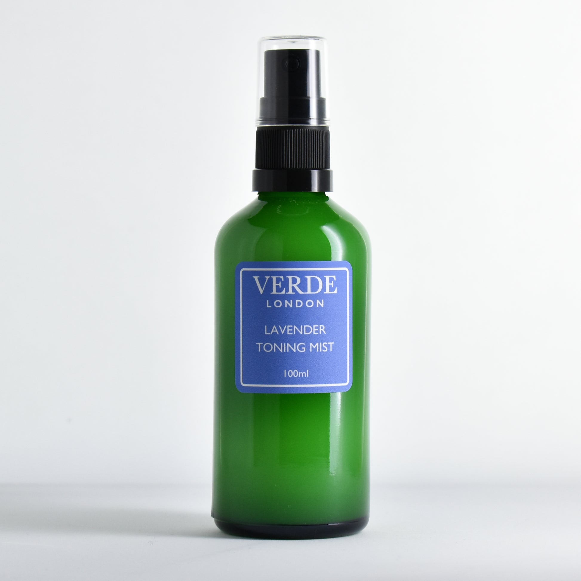 Green glass spray bottle of Lavender Toning Mist by the brand Verde London with a blue label on a white background