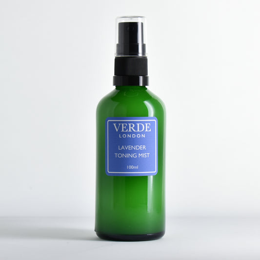 Green glass spray bottle of Lavender Toning Mist by the brand Verde London with a blue label on a white background