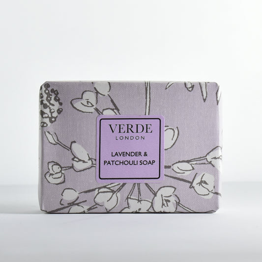 Lavender & Patchouli Soap Bar by Verde London wrapped in purple flower patterned paper with a purple label on a white background