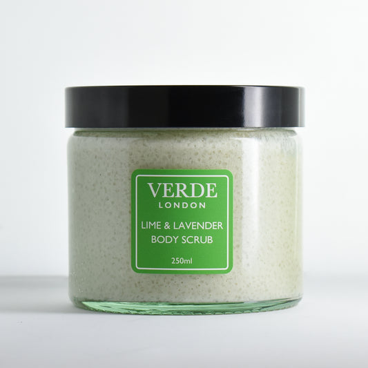 Glass jar of Lime & Lavender Body Scrub by Verde London with a green label on a white background