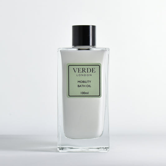 Bottle of 100ml Verde London Mobility Bath Oil, white milky colour in a rectangular glass bottle on a white background
