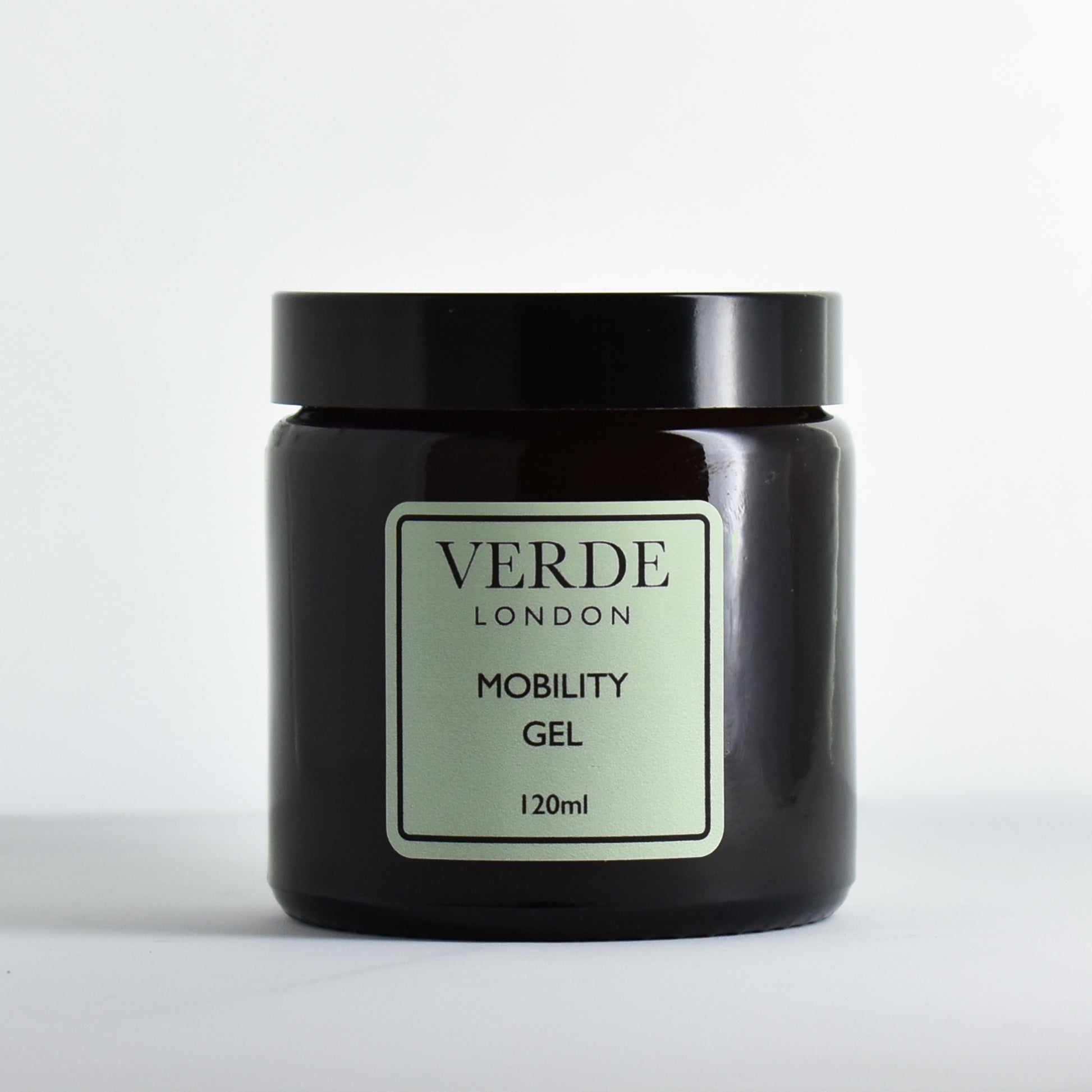 Amber glass jar of Verde London Mobility Gel with a pale green label on a white background