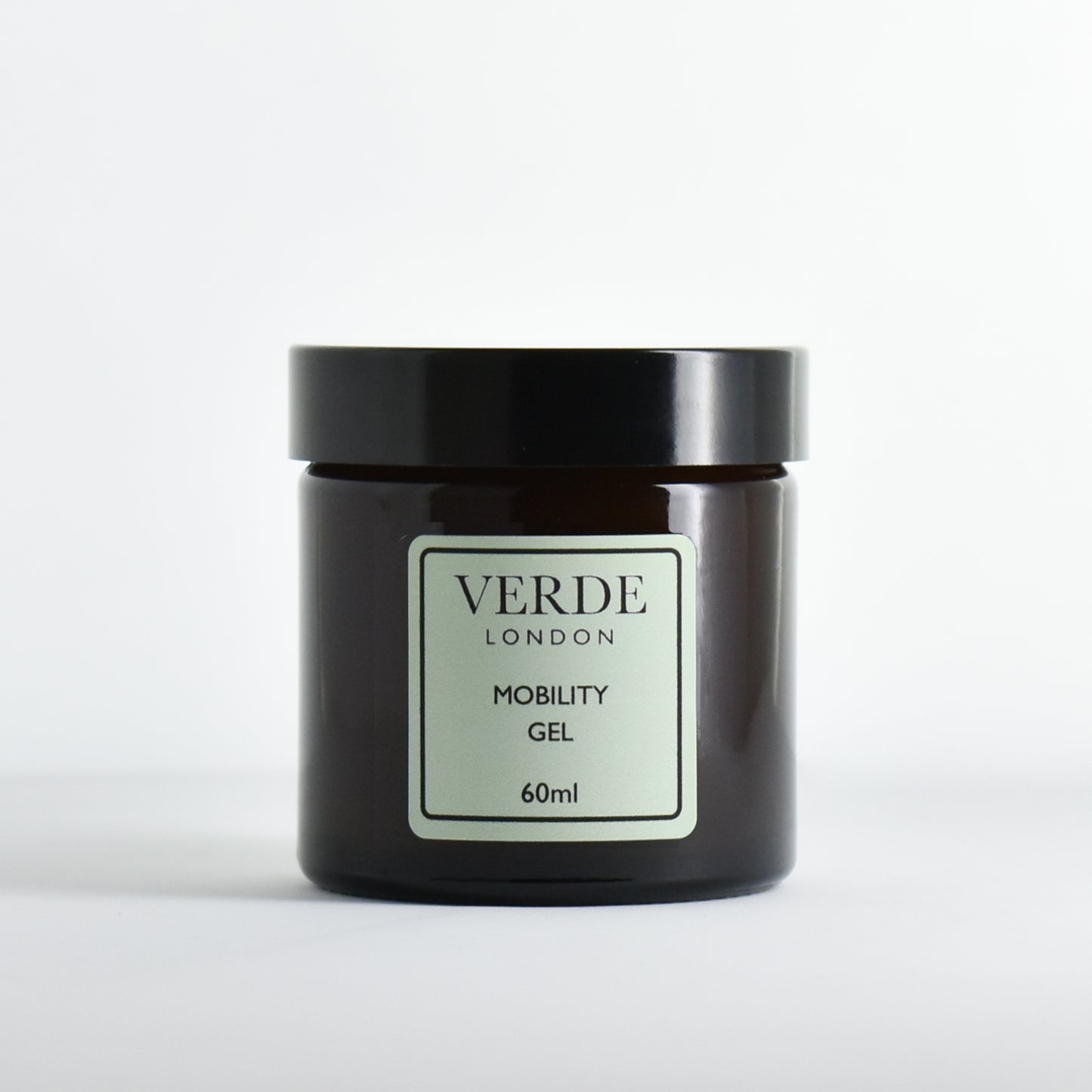 Amber glass jar of Verde London Mobility Gel with a pale green label on a white background
