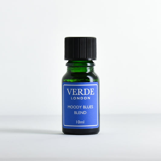 Green glass dropper bottle with a blue label containing 'Moody Blues Blend' by Verde London on a white background.