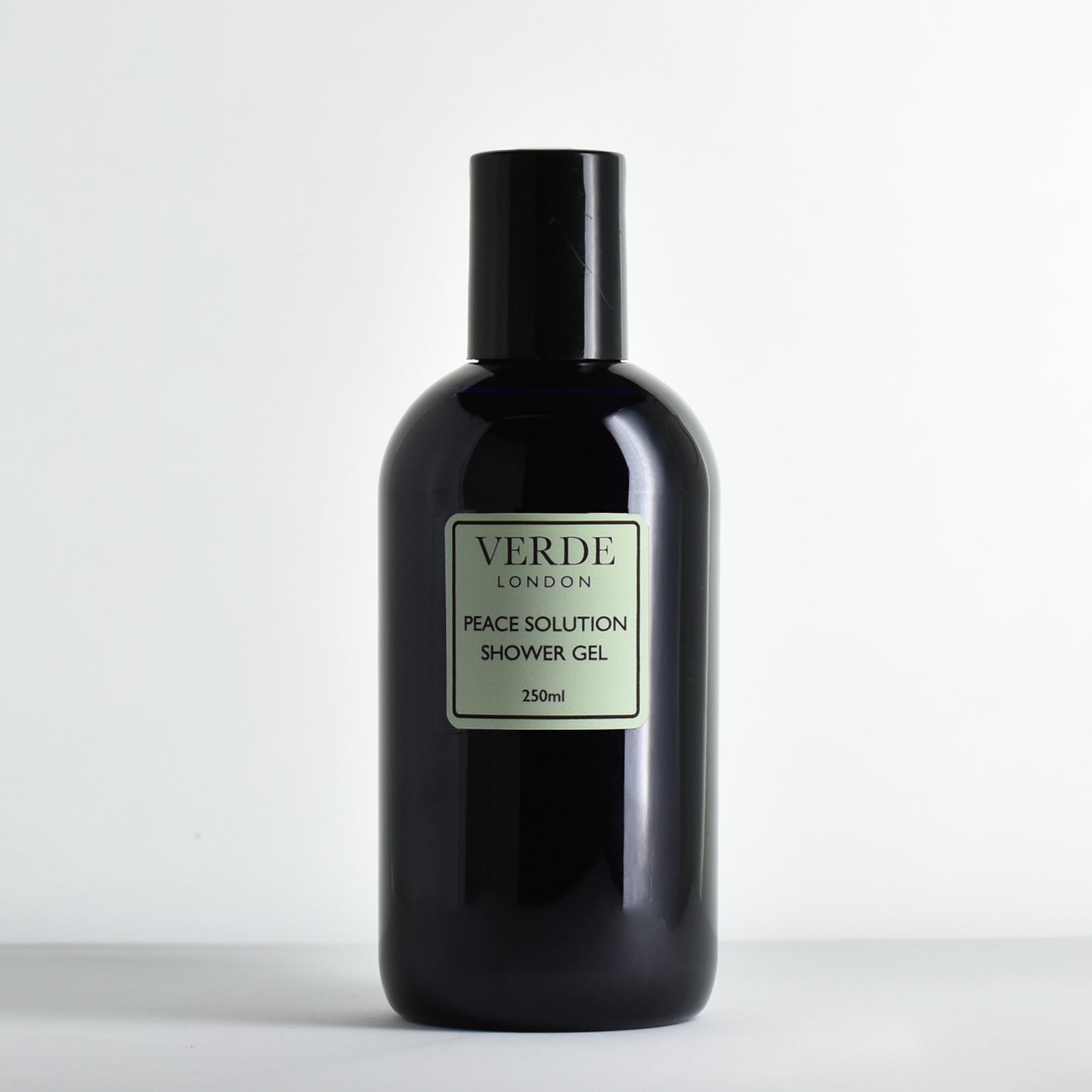 Blue bottle of Verde London Peace Solution Shower Gel on a white background