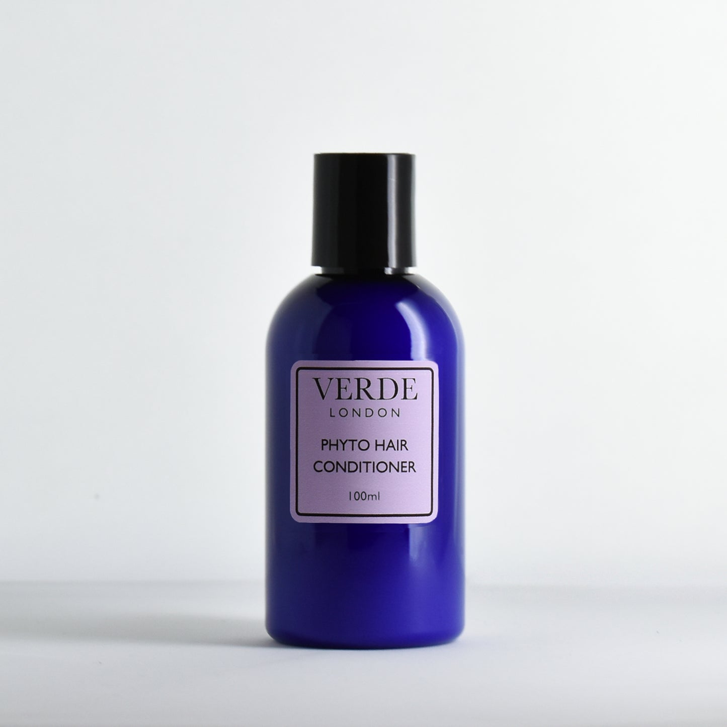 Blue bottle of Verde London Phyto Hair Conditioner on a white background