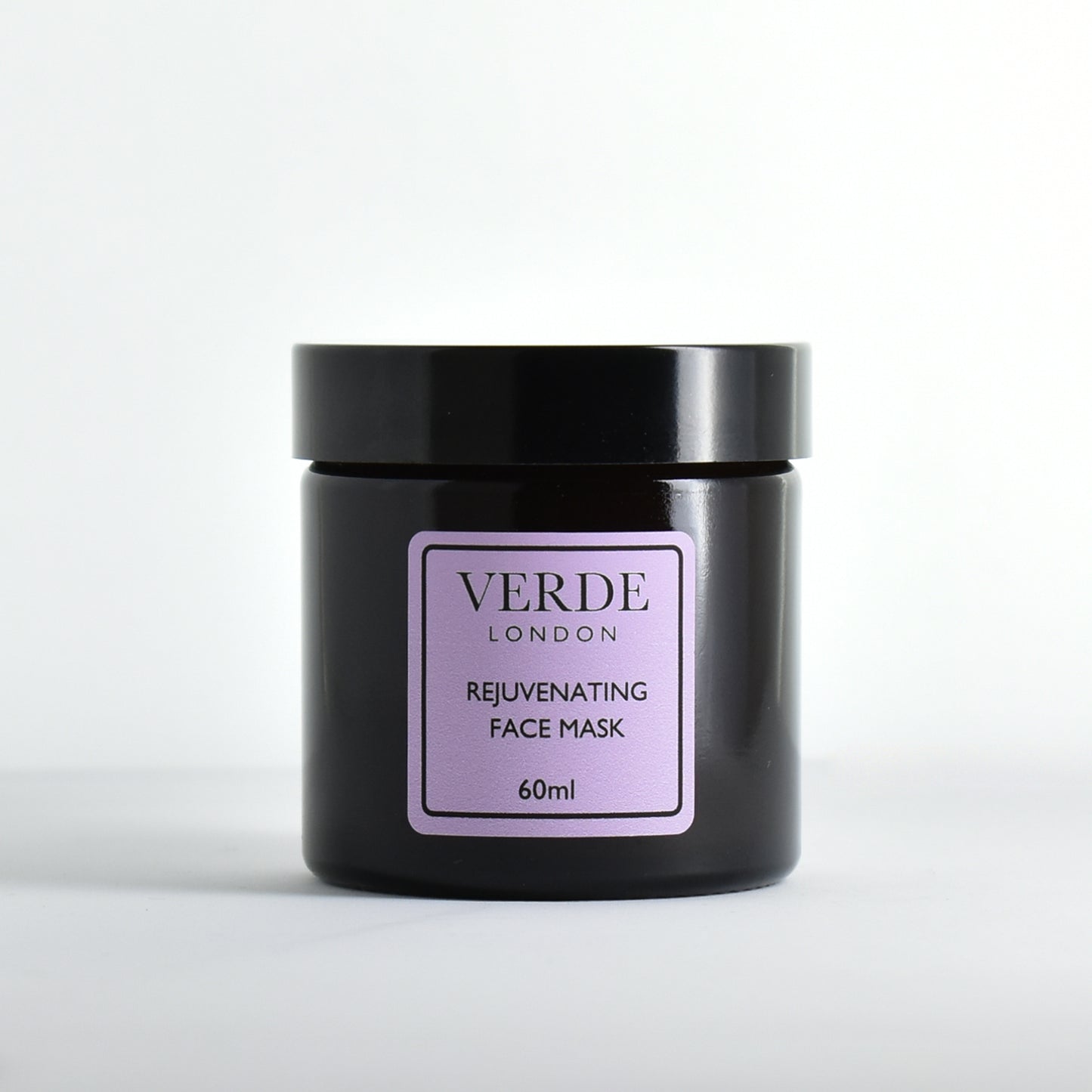 Amber glass jar of Verde London Rejuvenating Face Mask with a purple label on a white background