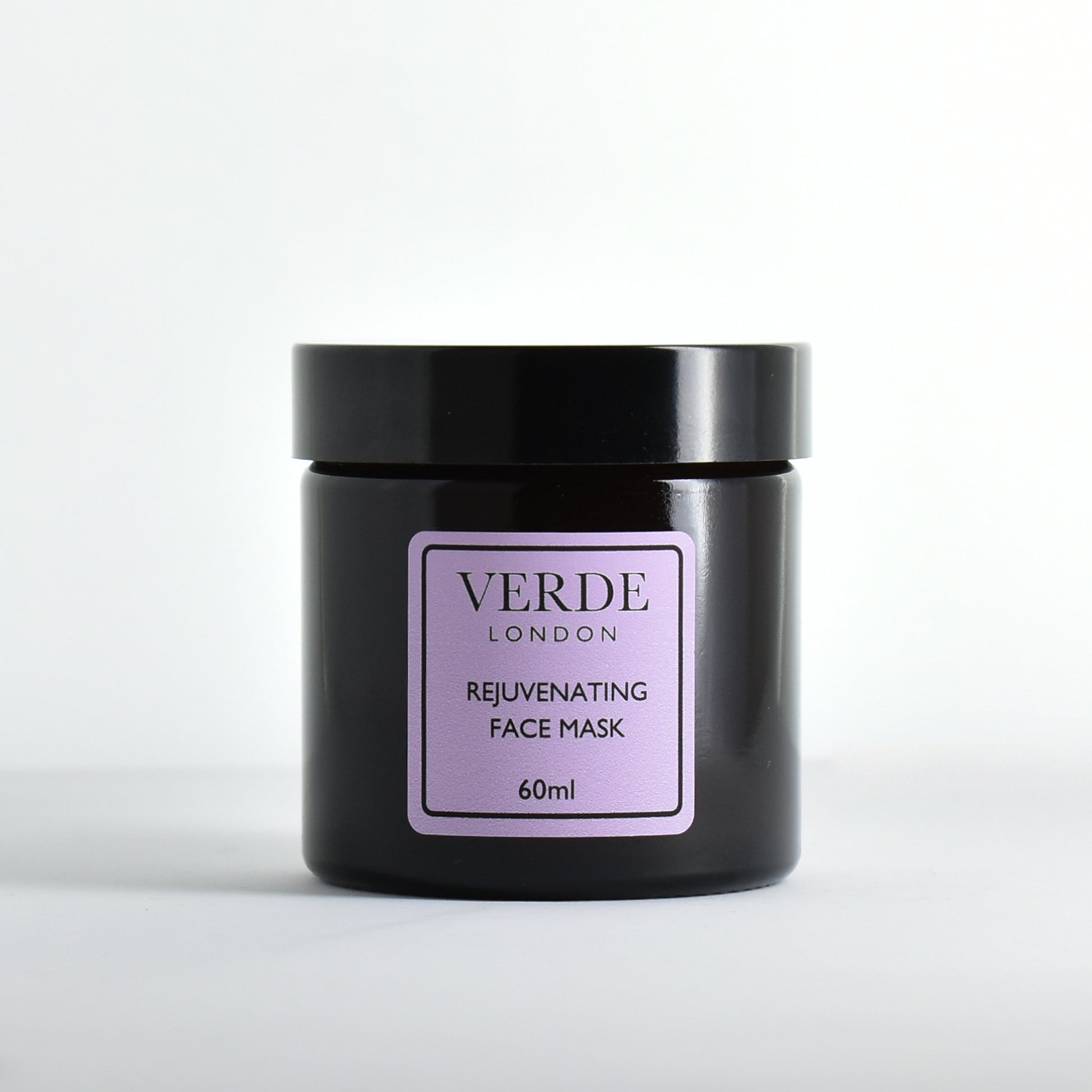 Amber glass jar of Verde London Rejuvenating Face Mask with a purple label on a white background