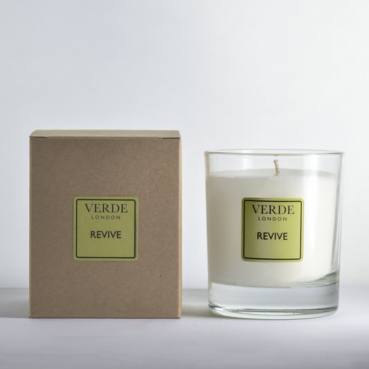 Verde London Revive candle with pale green label and packaging on a white background