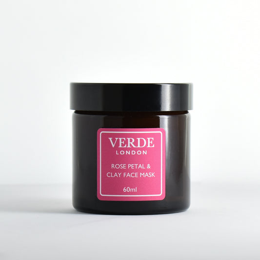 Amber glass jar of Verde London rose petal and clay face mask with a pink label on a white background