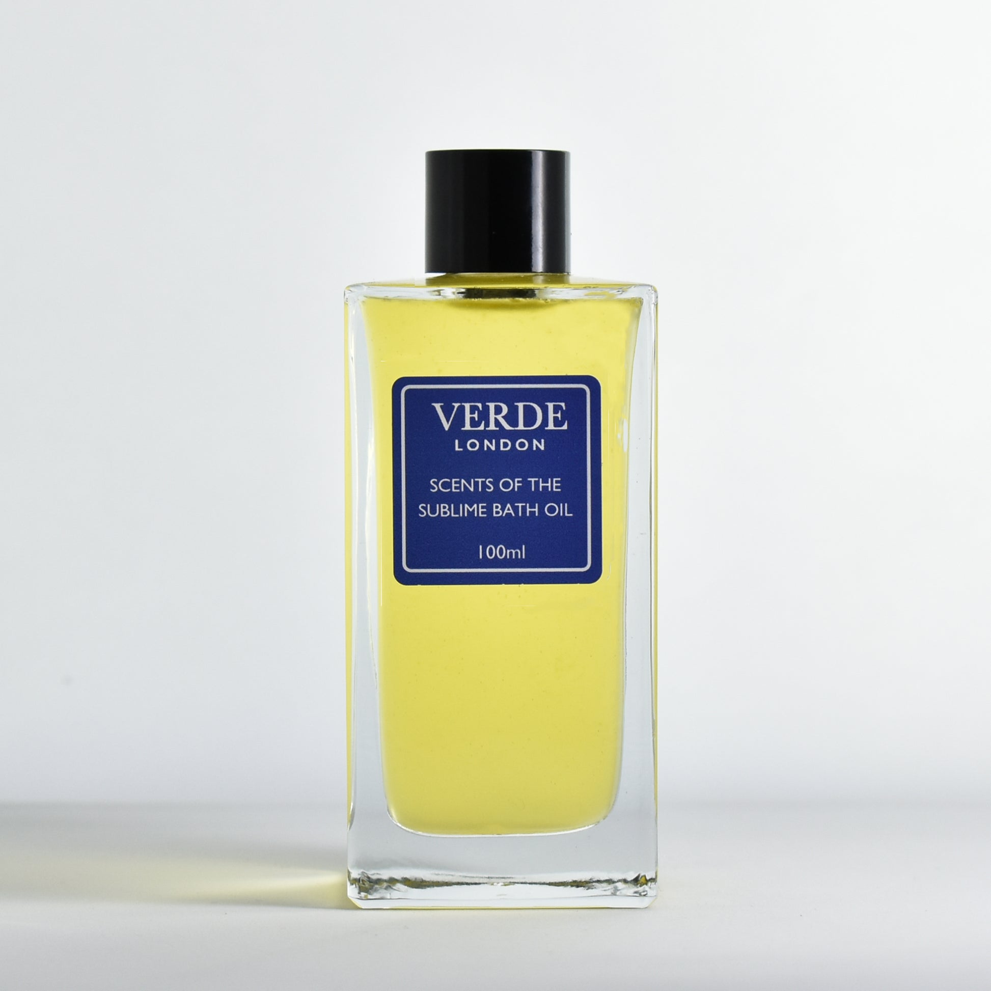 100ml bottle of Verde London Scents of the Sublime Bath oil with a dark blue label in a rectangular glass bottle on a white background