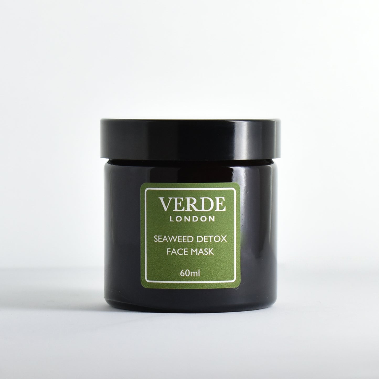 Amber glass jar of Verde London Seaweed Detox Face Mask with a green label on a white background