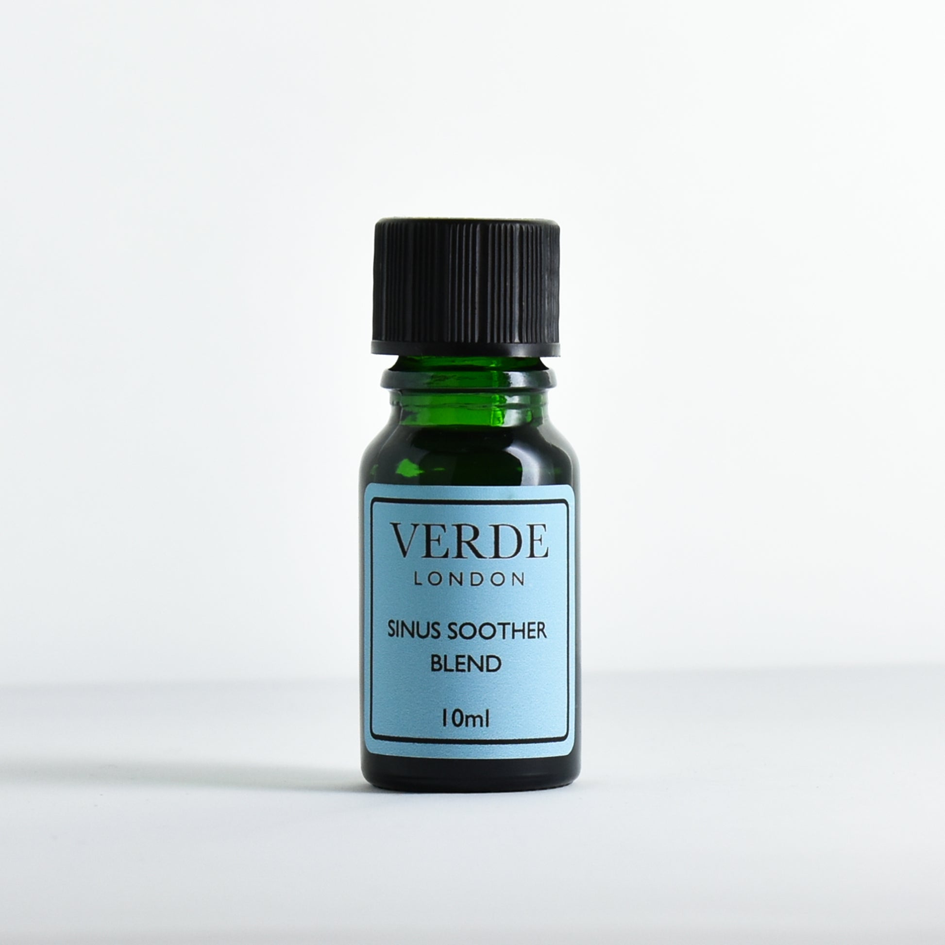 Green glass dropper bottle labeled 'Verde London Sinus Soother Blend' on a white background