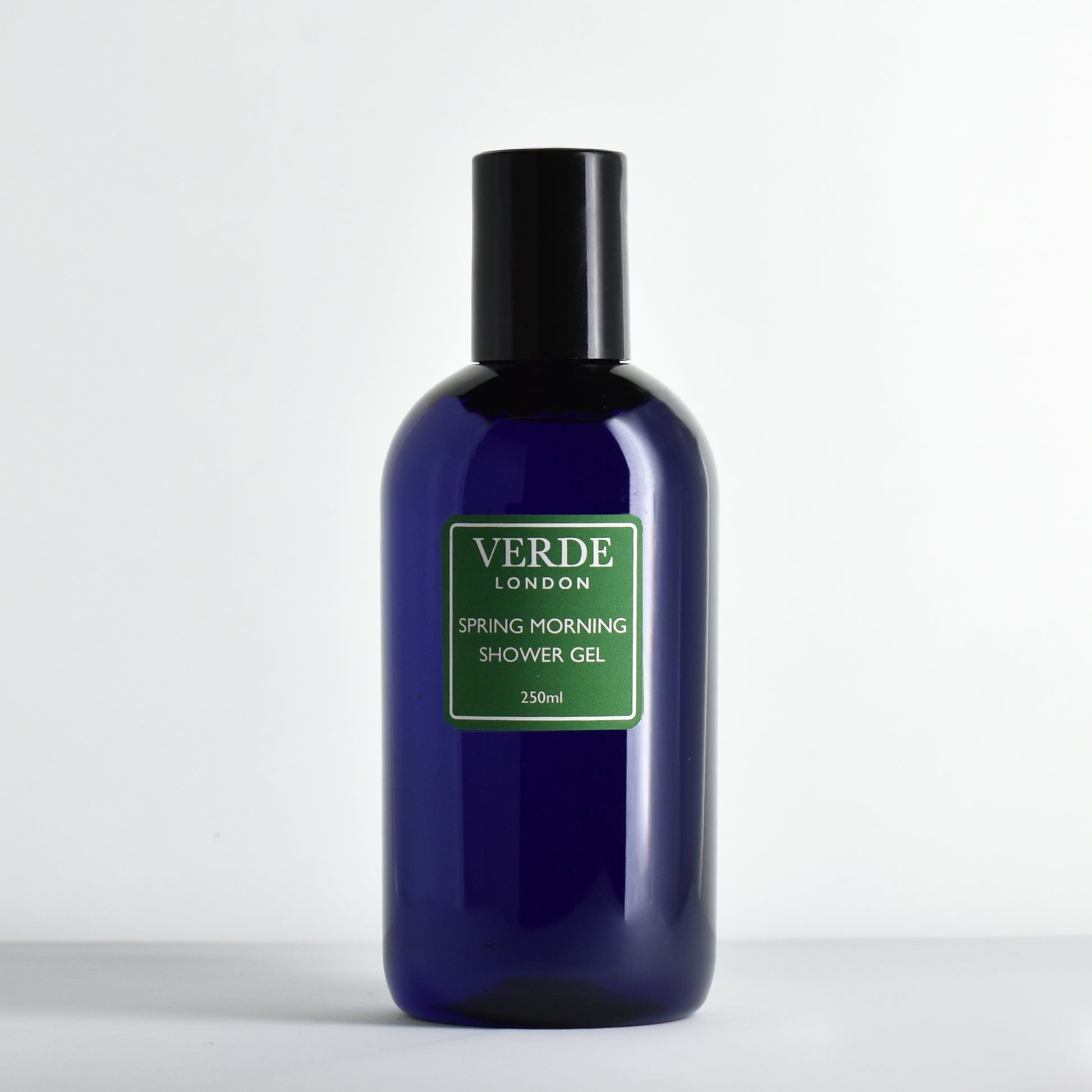 Blue bottle of Verde London Spring Morning shower gel with a green label on a white background