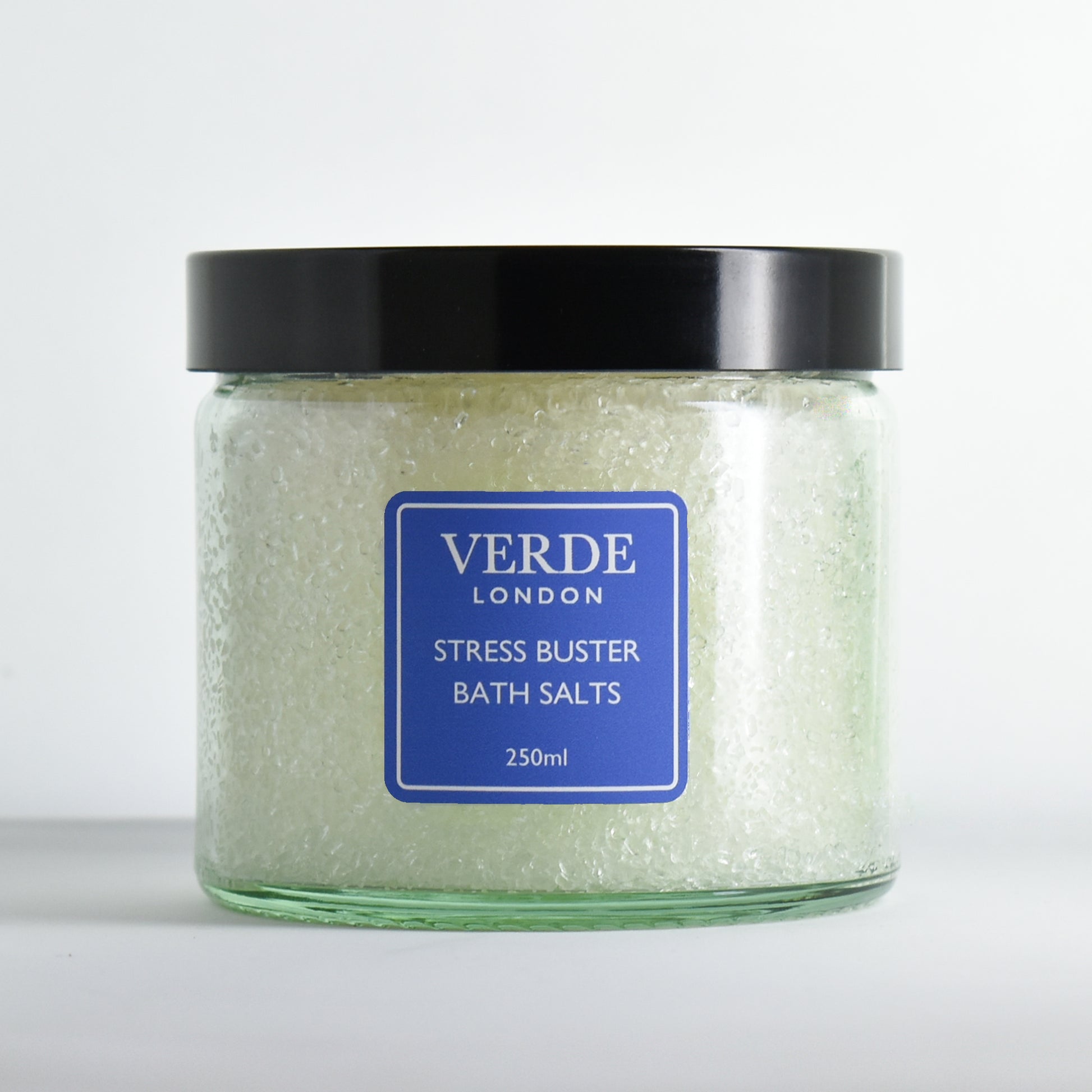 Glass jar of Verde London stress buster bath salts on a white background