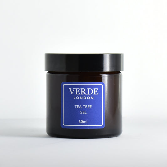 Amber glass jar of Verde London Tea Tree Gel with a blue label on a white background