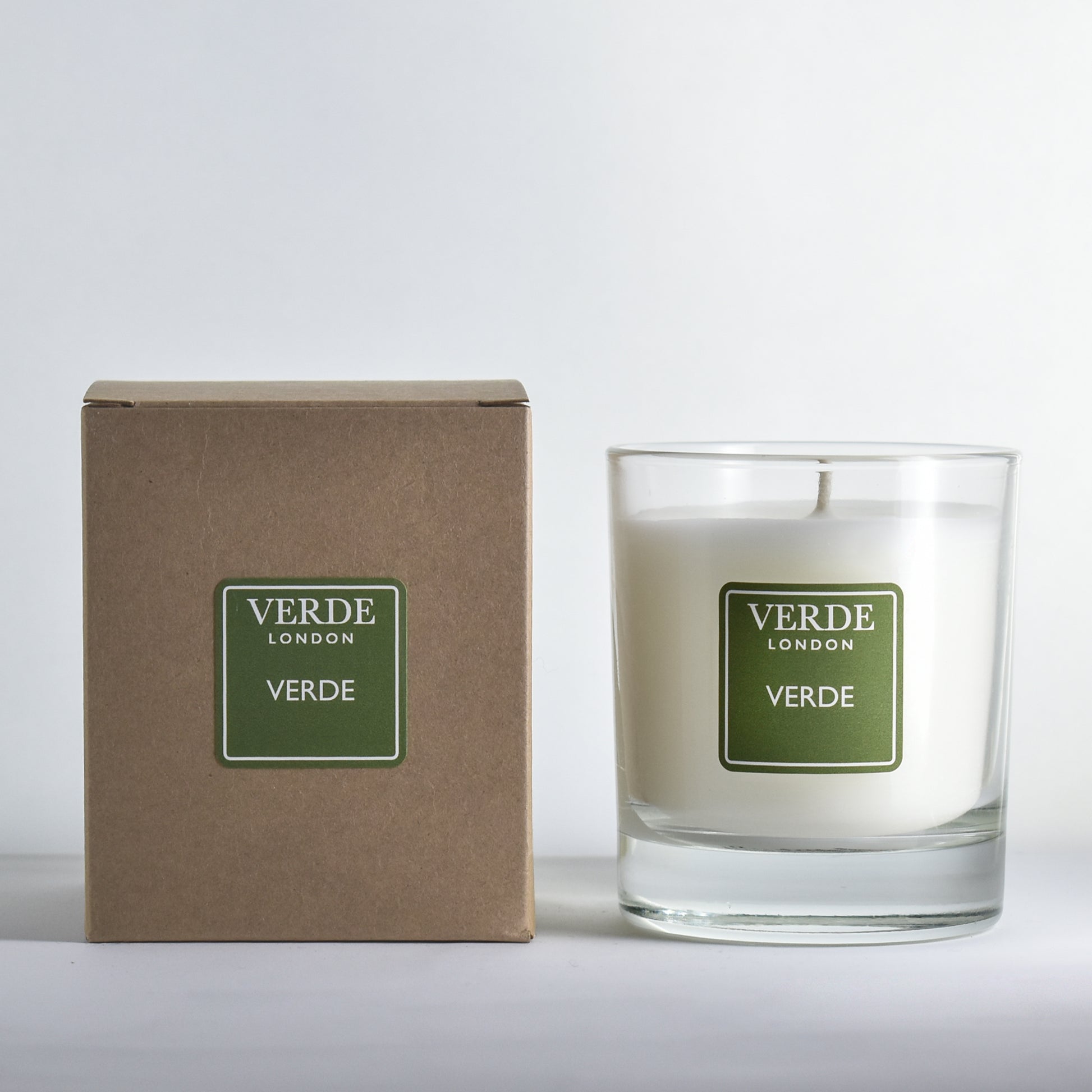 Verde London candle with green label and packaging on a white background